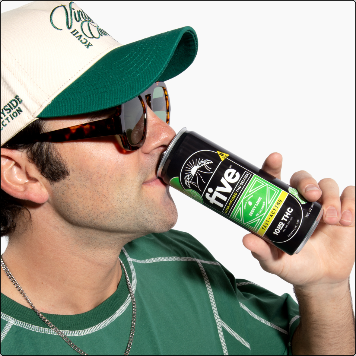 Man in green cap and sunglasses drinking from a can labeled five; label also reads 100 THC.