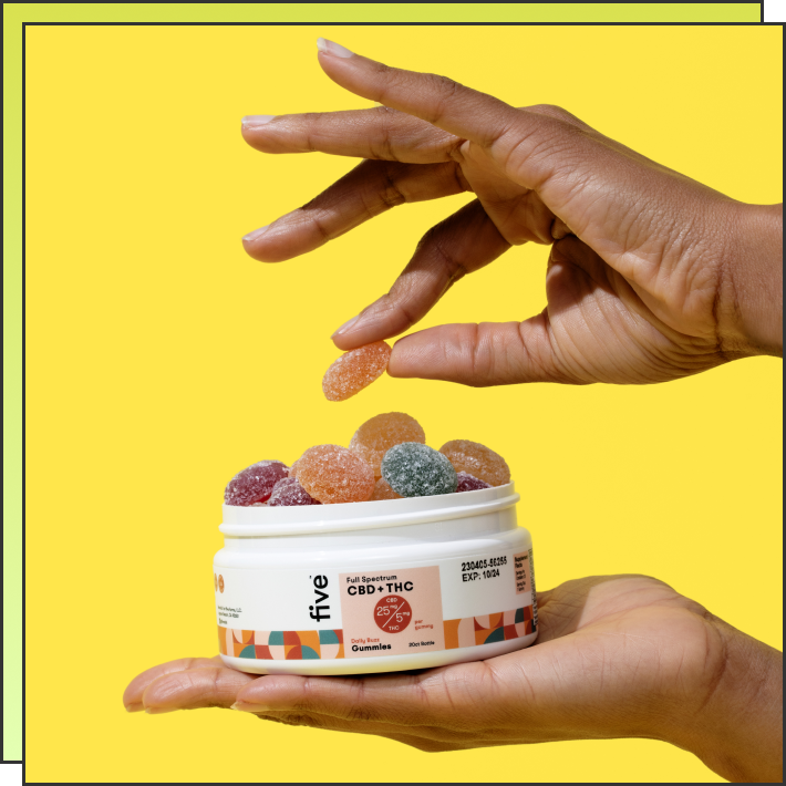 Two hands holding and picking a gummy from a container labeled 'five Full Spectrum CBD + THC 25 mg / 5 mg Gummies'.